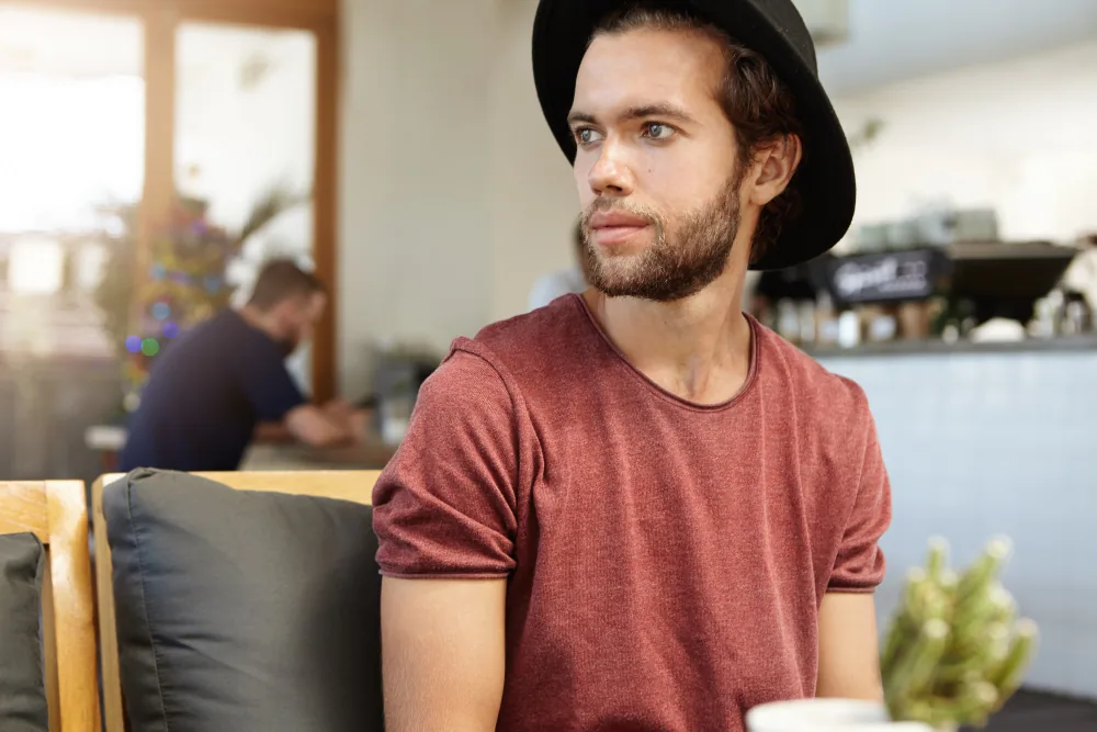 Man showing physical restlessness and distractibility during a task requiring sustained focus