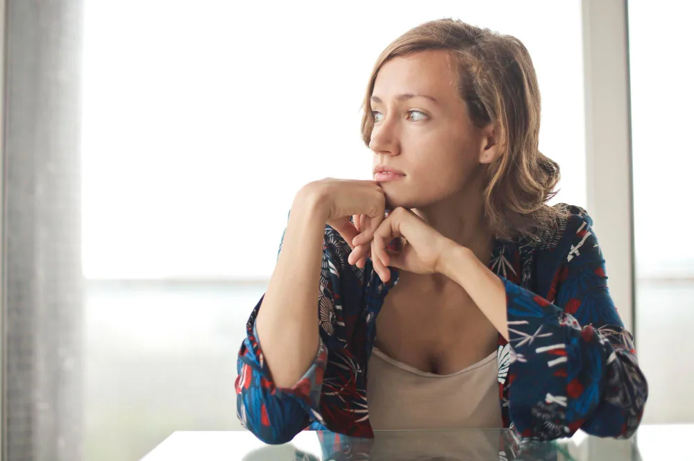 Woman having difficulty sustaining attention while completing a detailed work task