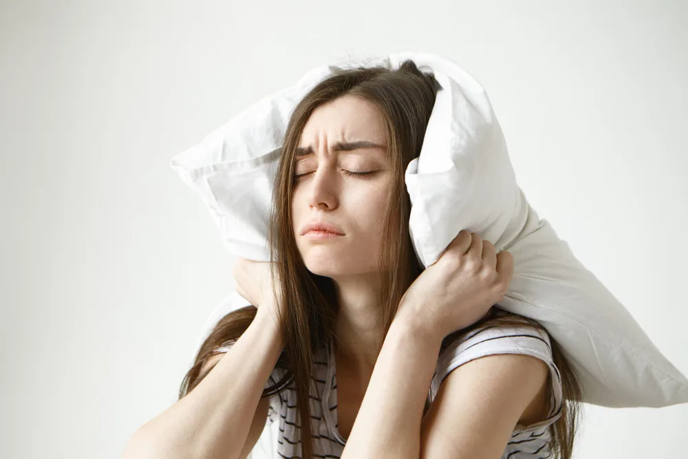Woman feeling overloaded by competing household responsibilities and unfinished daily tasks