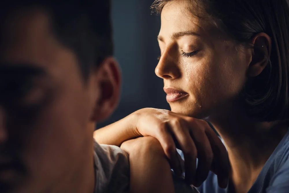 Woman showing emotional distress while coping with an intense period of anxiety