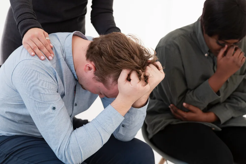 Man feeling overwhelmed by compulsive urges and the pressure to complete repeated rituals