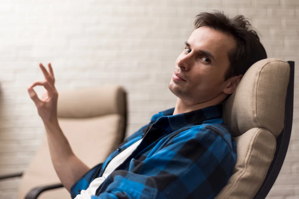 Man working to manage repetitive thoughts that repeatedly interrupt attention and decision making