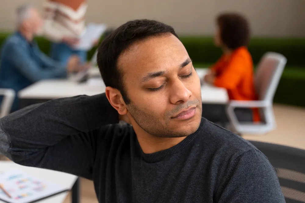 Man holding his chest while experiencing intense physical symptoms during a panic attack