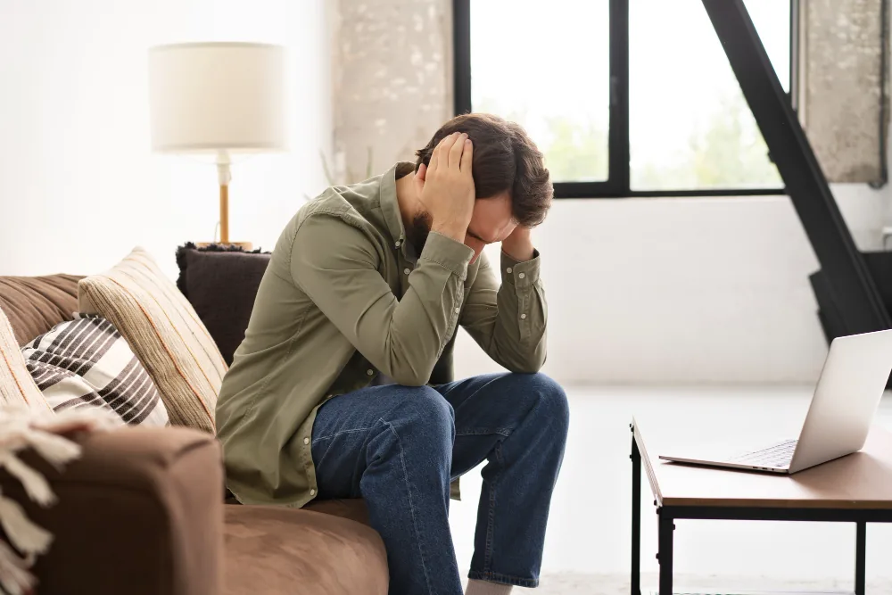 Man sitting quietly while recovering after the most intense phase of a panic attack