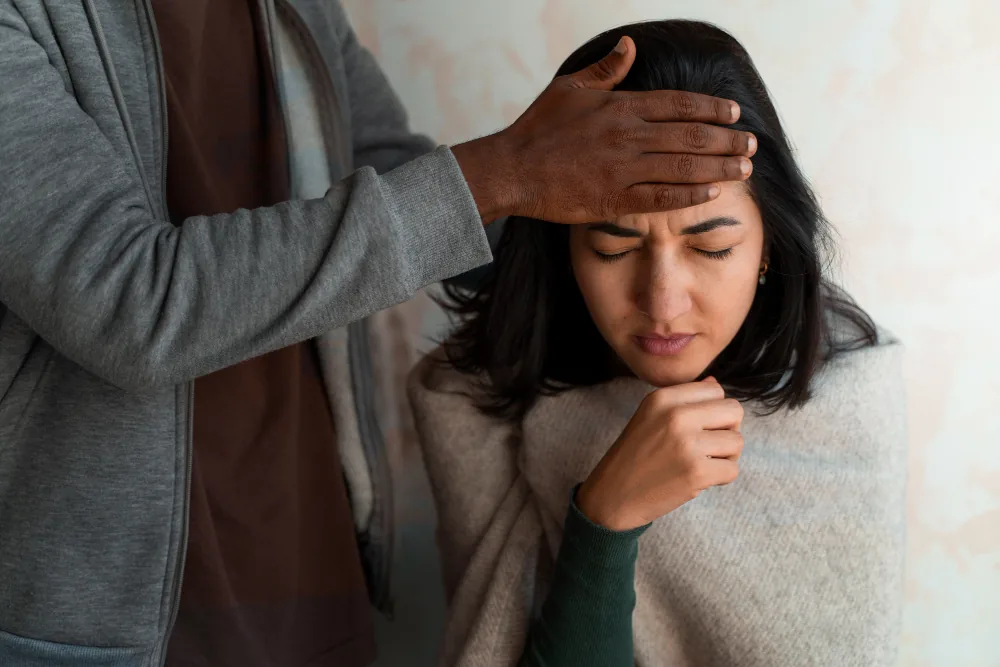 Woman feeling overwhelmed by a trauma reminder and PTSD-related distress