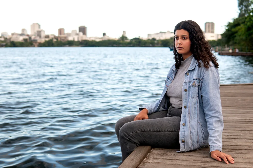 Woman reflecting quietly while processing the emotional effects of a traumatic experience