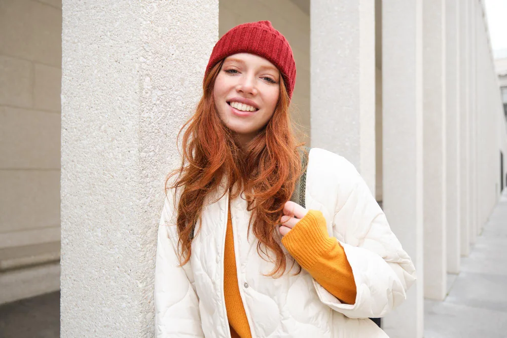 Woman smiling brightly during a virtual consultation
