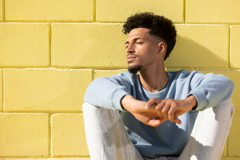 Man relaxing comfortably in a modern calm environment
